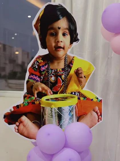 A life-sized cutout of the birthday girl, Poorvisha, adds a wonderful personal touch to her butterfly-themed celebration.