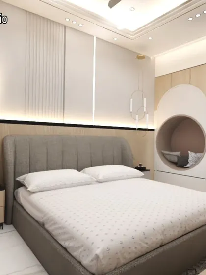 This bedroom features a unique circular nook built into the wall, creating a cozy reading spot. The design combines light wood tones and soft fabrics for a warm and inviting feel.