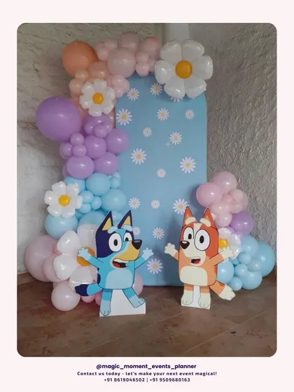 Bringing the fun of the Bluey cartoon to a birthday party. This setup features a custom daisy-print backdrop, character cutouts of Bluey and Bingo, and a pastel balloon arrangement with flower-shaped balloons.
