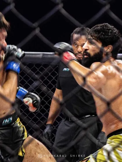 A perfectly timed punch from Sanjeet Budhwar, captured through the cage. Precision and power in a single frame.