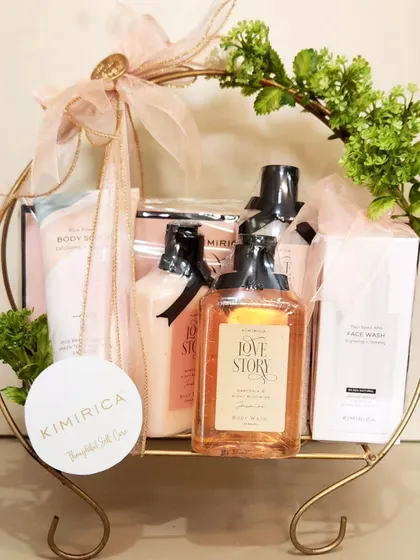A closer look at one of the Kimirica hampers we styled, featuring their "Love Story" collection in a beautiful gold wire basket with fresh greenery.