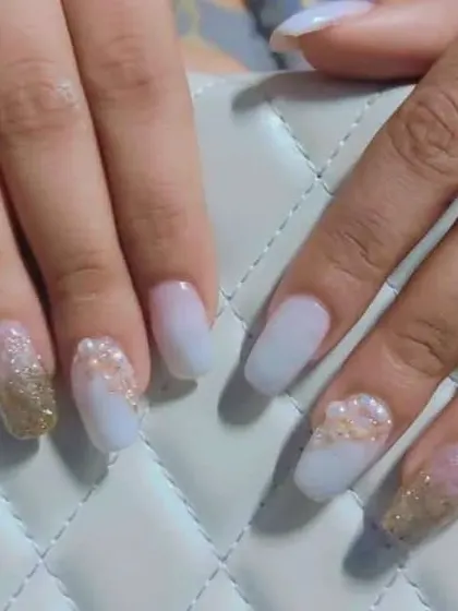 This is a beautiful set for an engagement or special occasion, featuring a soft white base with a cascading gold and pink glitter ombre effect.
