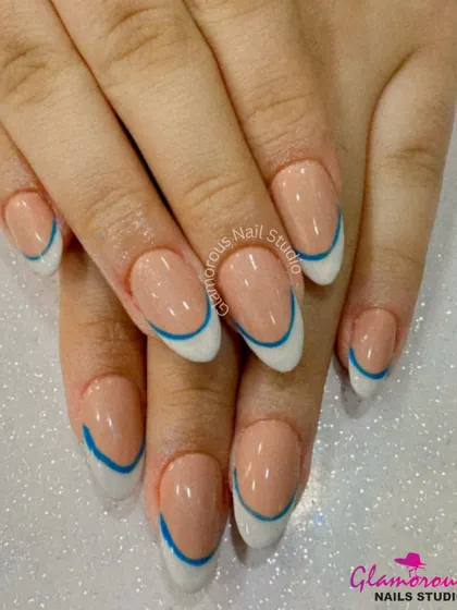 We believe even classics can have a modern twist. Here, we've updated the timeless French manicure with a clean white tip and a sharp, electric blue line for a look that is chic, clean, and totally unique. It's a perfect example of minimalist design with maximum impact.