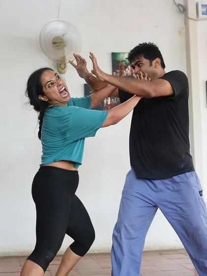 A moment of physical comedy during a "Gretel" rehearsal.