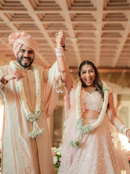 The newly married couple makes their exit, their faces beaming with joy and excitement for their new life together.