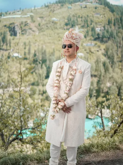 A groom stands against the stunning backdrop of the Jubbal valley. My goal is to make my portraits feel both personal and epic, integrating the character of the location.