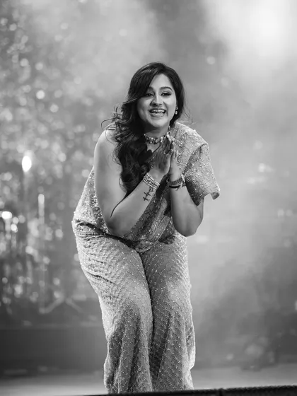 A black and white shot from a stage performance, filled with gratitude for the audience and the art of dance.