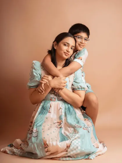 A loving hug from her older son. Capturing the individual relationships within a family is just as important as the group shot.