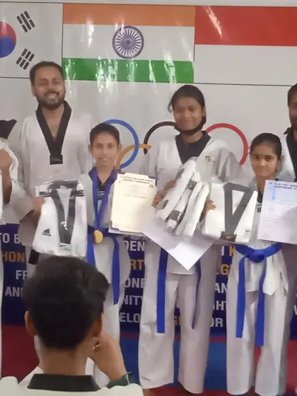 Another angle of our students with their new uniforms and certificates, celebrating their hard-earned success.