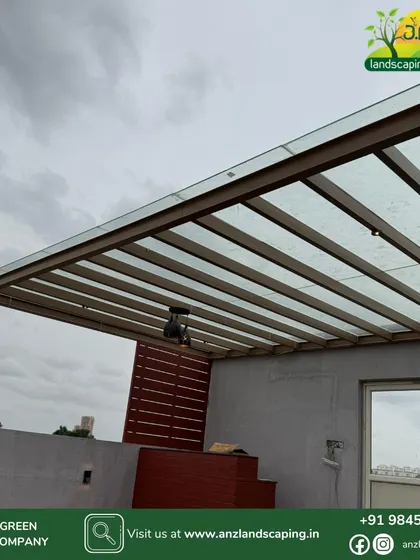 A close-up of the pergola structure, highlighting the powder-coated mild steel frame and toughened glass roofing. This combination is durable, weatherproof, and requires minimal maintenance.