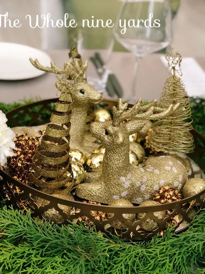 A detailed look at the golden reindeer centerpiece, a perfect accent for a festive and elegant holiday table setting.