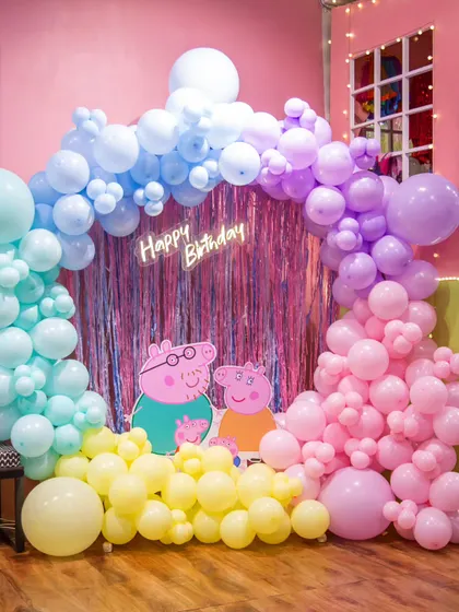 I love bringing cartoon worlds to life! This Peppa Pig theme features a custom pastel balloon arch and character cutouts for a fully immersive experience.