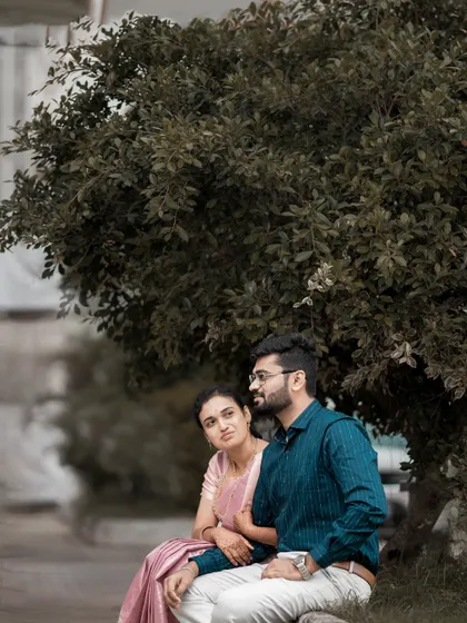 Another shot of the same couple, capturing a different angle and mood against the natural backdrop.