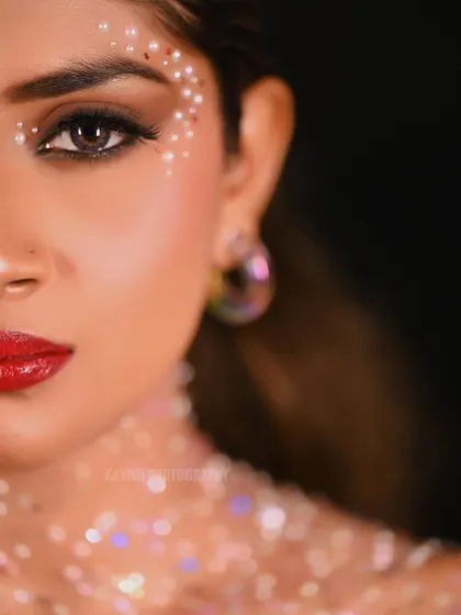 A close-up artistic beauty portrait focusing on creative makeup with pearl and glitter details. This high-fashion shot highlights my ability to work with makeup artists to create striking visuals for model portfolios.