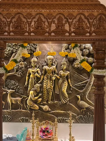 A closer look at the top of the mandap, where the carved details are complemented by our simple yet elegant marigold and jasmine flower garlands for the housewarming pooja.
