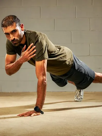 These are professional shots from a shoot, but they capture the essence of my training. Dynamic movements like plank shoulder taps, side lunges, and high knees are staples in my functional fitness programs.