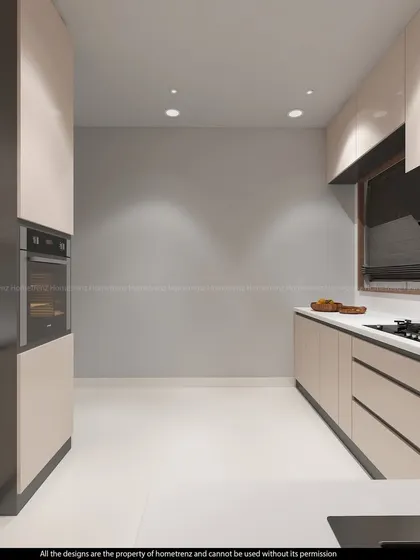 A view of a galley kitchen, showing how I use a consistent cabinet finish to create a sense of length and cohesion in a narrow space.