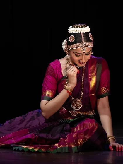 A moment of quiet contemplation, where the Nayika is lost in thought. The seated posture allows for a focus on subtle facial expressions.