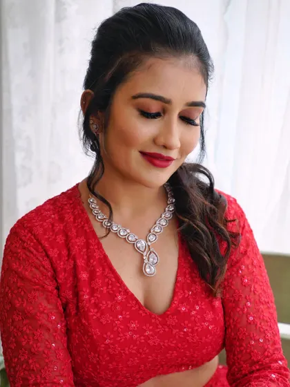 A soft and romantic portrait. The makeup is designed to look flawless and radiant, enhancing her natural beauty.