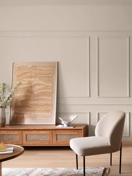 This living room from "Apartment 222" feels like a warm hug. We used a palette of soft, earthy tones and natural materials like wood and linen, with classic wall molding to add a touch of timeless elegance. The space is calm, balanced, and elevated.