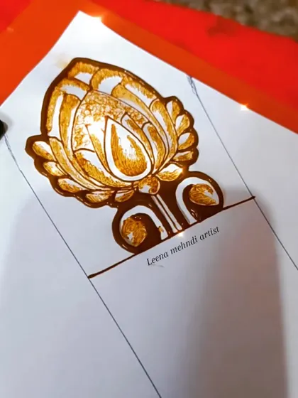 The outline of a large lotus cuff. This is the first stage of a design we practice in my floral henna workshop.