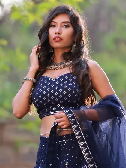 A powerful, confident pose that showcases the entire look. This image is perfect for a model's portfolio, demonstrating their ability to convey different emotions and styles.