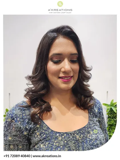Our client looking down, showing off the subtle shimmer on the eyelids and the flawless blending of her party makeup.