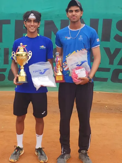 With doubles partner Rian Sharma after their win.