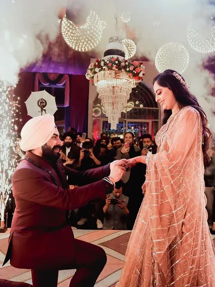 A grand proposal on a beautifully decorated stage, complete with pyrotechnics. I capture the full scale of your celebration.