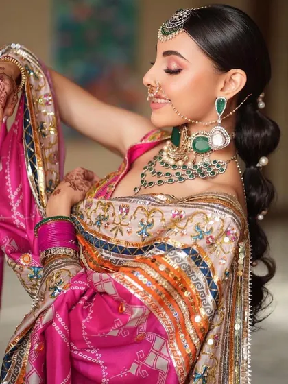 A vibrant and playful Punjabi bridal look. You'll learn how to work with bright colors like pink and emerald, creating a look that is full of joy and celebration.