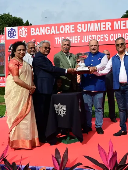 Hon'ble Justice B.S. Patil presents The Chief Justice's Cup (GR III) to the winning connections of Ranquelino.