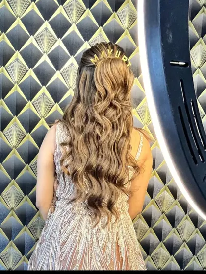 A view of the beautiful hairstyle that complements this party gown.