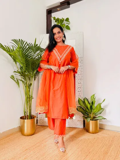 An elegant orange Anarkali-style suit. The color is festive and the fit is very graceful. A beautiful find from Myntra's festive collection.