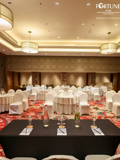 Here, my banquet hall is set up with a head table for a panel discussion or formal address. This demonstrates my ability to cater to specific event formats, ensuring your conference or meeting runs smoothly.