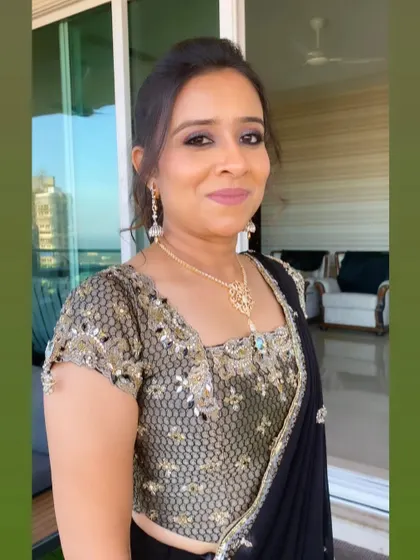 A close-up portrait showing her radiant skin and the soft, blended eye makeup. It’s a look that is both glamorous and understated.