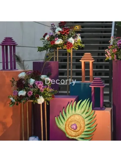 The colorful decor corner, showcasing the blend of floral arrangements, lanterns, and artistic props.