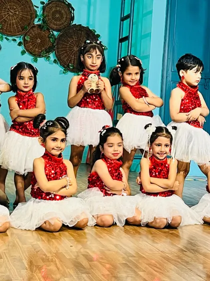 Our beginner batch posing for a group photo in their costumes. They look like a team of little superstars.