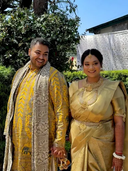 A happy couple portrait during their Haldi ceremony, with the bride looking radiant in her traditional attire.