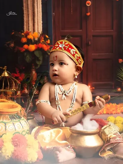 This little one is ready to steal some butter! The smoky effect adds a mystical touch to this vibrant Janmashtami scene.