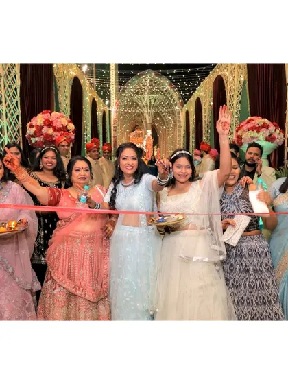 The bride's side of the family at the ribbon-cutting ceremony, a playful tradition.