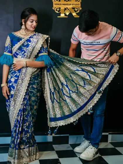 Demonstrating how to arrange the pallu of a Banarasi saree during a workshop. The final fall of the pallu is crucial for an elegant look.