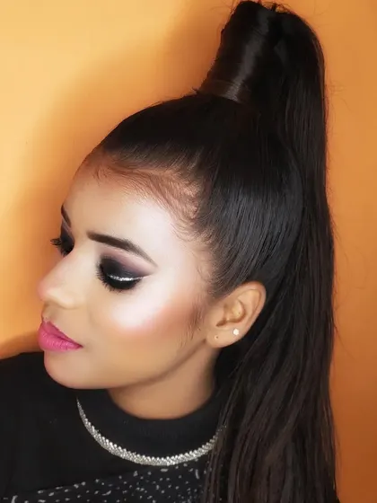 A side profile of the graphic smokey eye, paired with a high ponytail for a very sharp and stylish look.