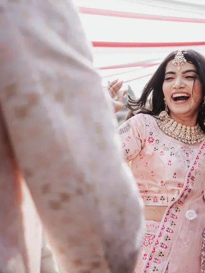 The bride's infectious laughter captured in a candid moment. These are the real, unposed memories you'll love looking back on.