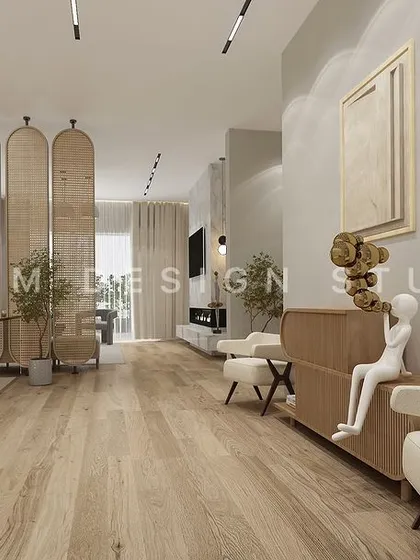 A long corridor in the Japandi-style home features light wood flooring and sculptural decor. The design prioritizes open space and natural materials to create a peaceful flow.
