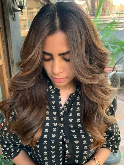 A happy client with her new warm brunette hair. The color and cut are so flattering. (No filter)