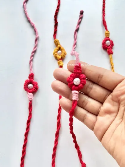 The detail on these handmade Rakhis is what makes them so lovely. The knotted flower design is unique and made with so much care.