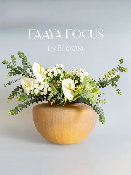 Faaya Focus in bloom. This mustard-colored bowl vase provides a warm, earthy base for a wild arrangement of anthuriums and eucalyptus, a collaboration with The Bloom Room Colaba.
