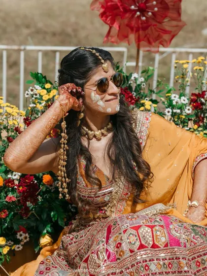 This Haldi ceremony was a burst of color and unforgettable moments. We used vibrant tissue flowers, playful origami birds, and colorful smoke bombs to bring the venue to life.