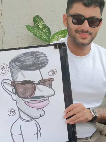 This guest's sunglasses and confident pose made for a very cool caricature.