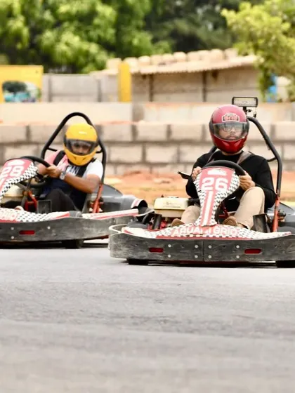 Another shot of two drivers racing closely, showcasing the fun of competing against friends on our wide track.